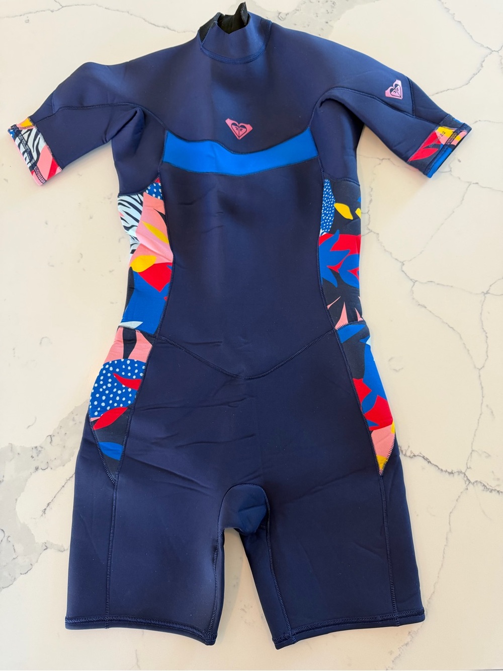 Roxy Navy Short Sleeve Kids Wetsuit with Pink & Blue Accents